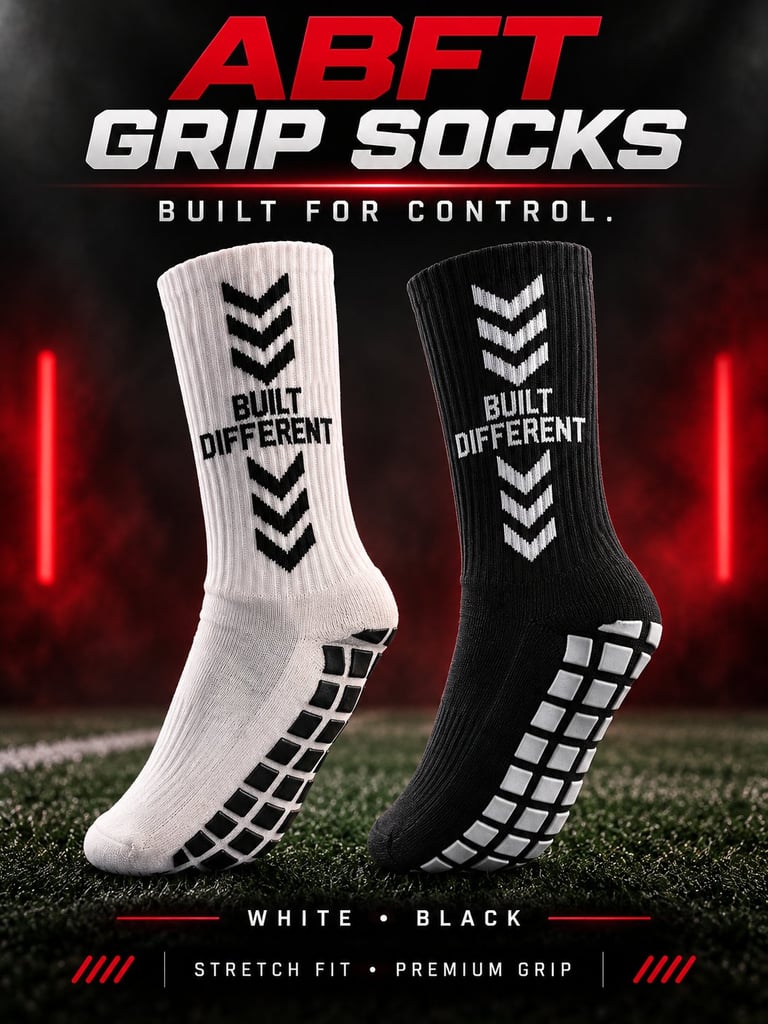 ABET Grip Socks product display showing white and black socks with chevron patterns and grid soles on grass background